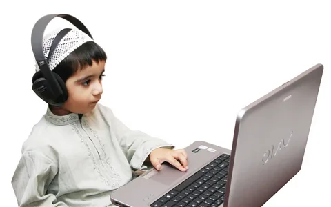 Muslim child reading the Holy Quran